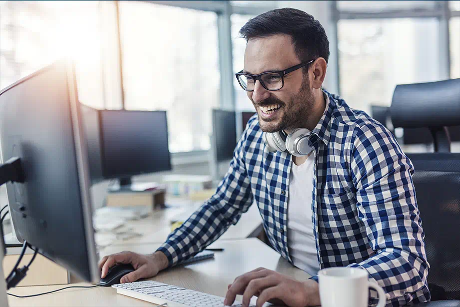 Main image Male in front of computer